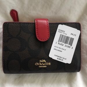 Dark brown and red Coach wallet